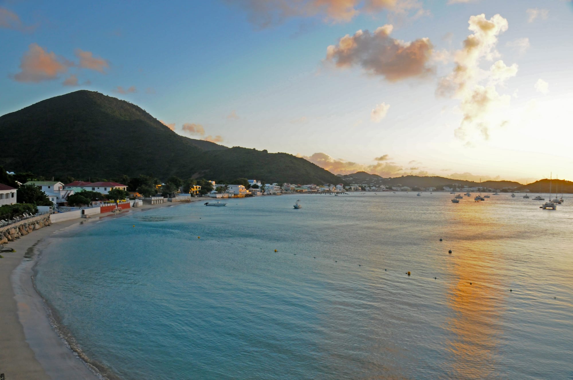 A calm bay with a small town of restaurants along the waterfront