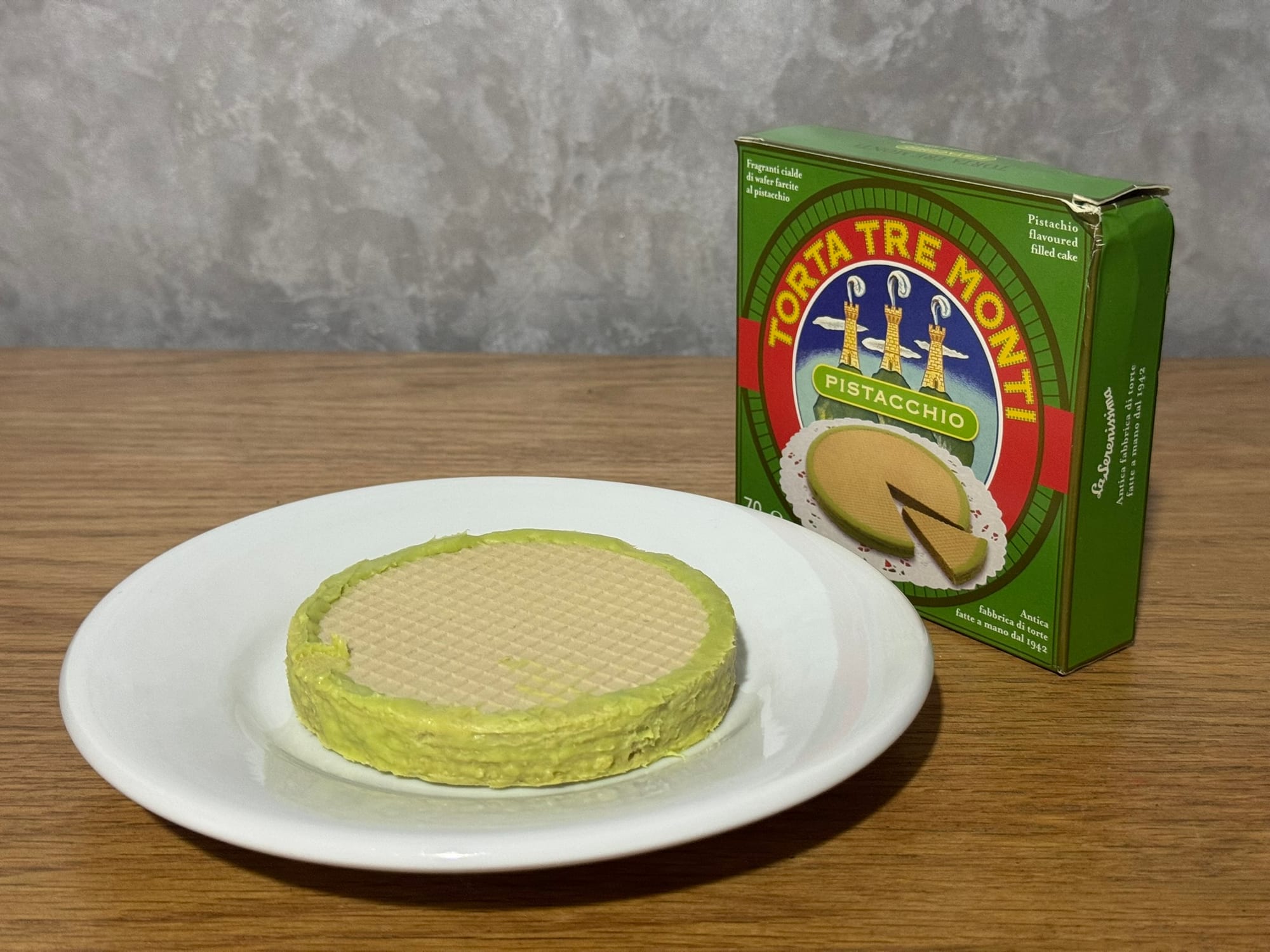 A layered wafer cake coated in chocolate
