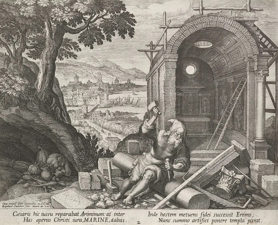 An old engraving of a bearded man seated among cut stone blocks, shaping a column with hammer and chisel beside a chapel under scaffolding, with a walled town and harbour in the distance
