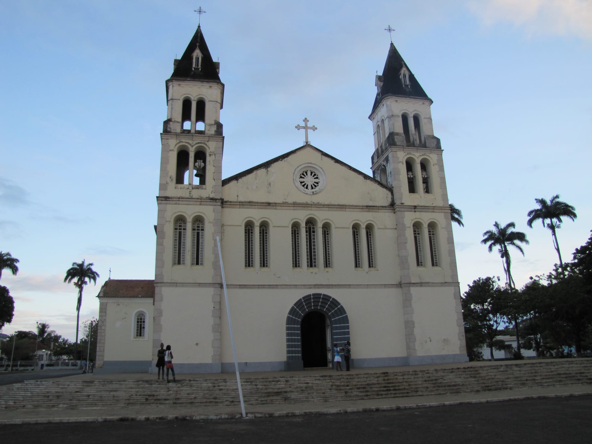 A whitewashed colonial-era cathedral with a red-tiled roof