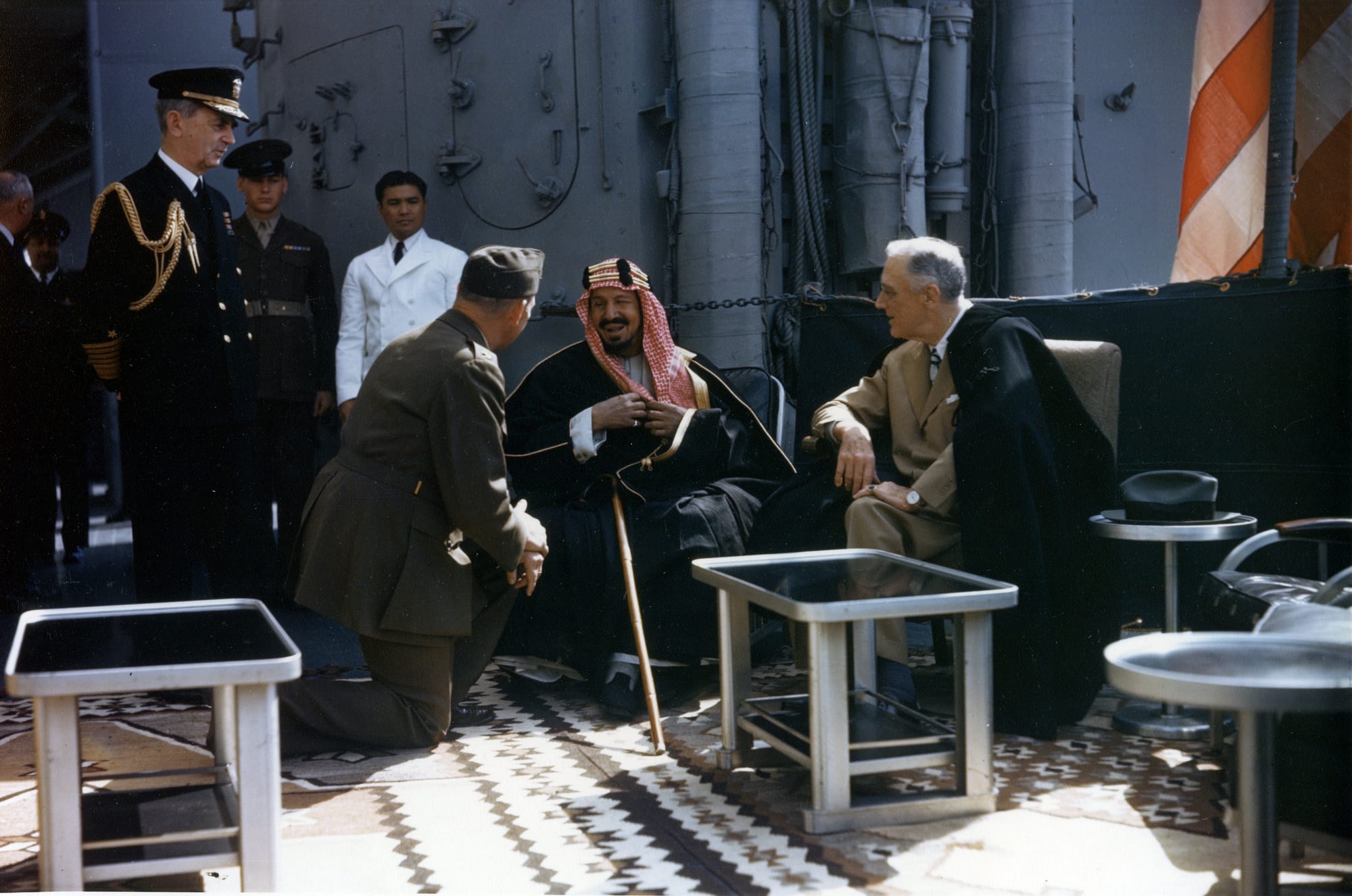 King Abd al-Aziz ibn Saud in conversation with Franklin Roosevelt aboard a US warship in 1945