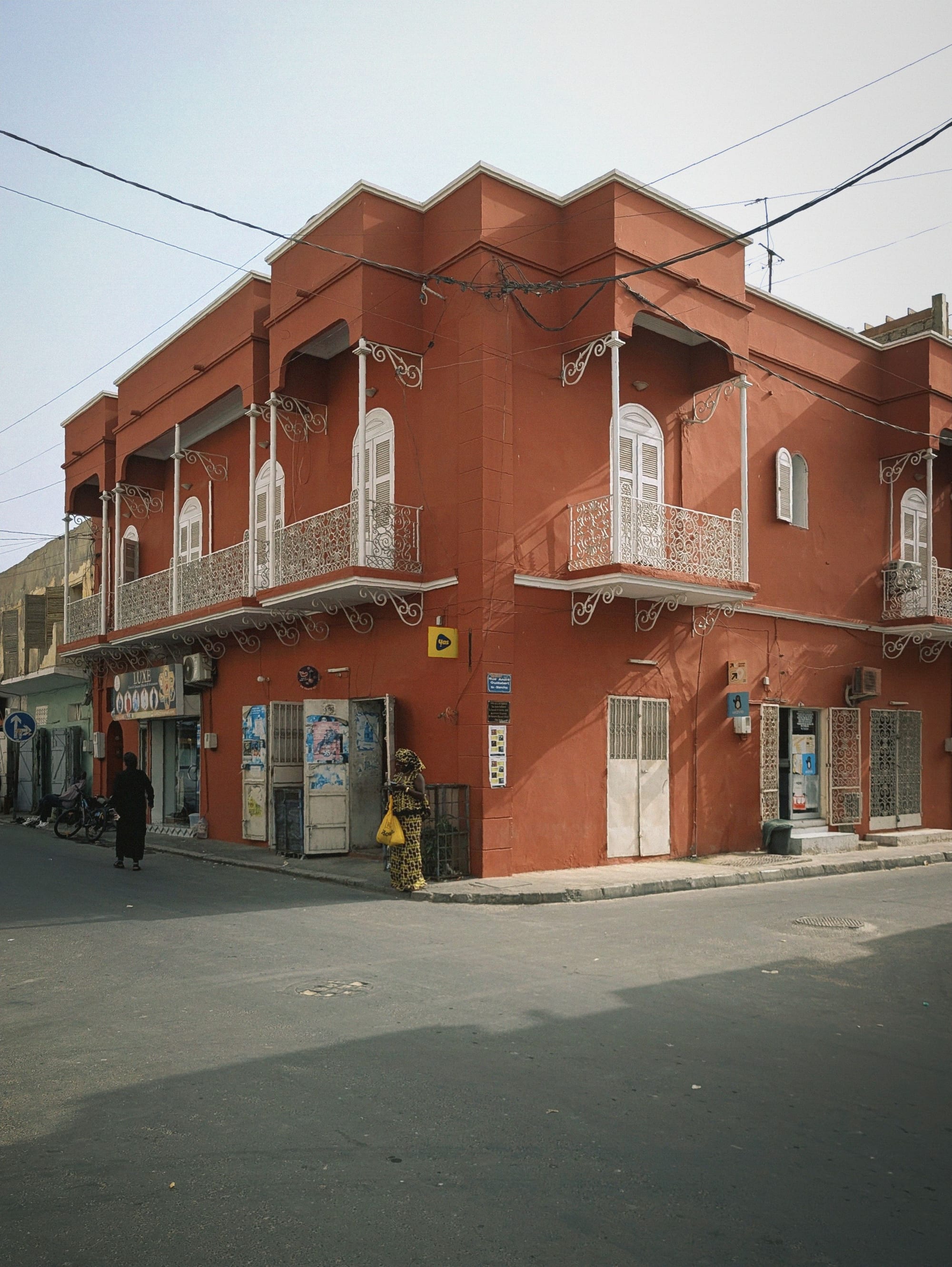 Colonial-era buildings with balconies along a quiet street