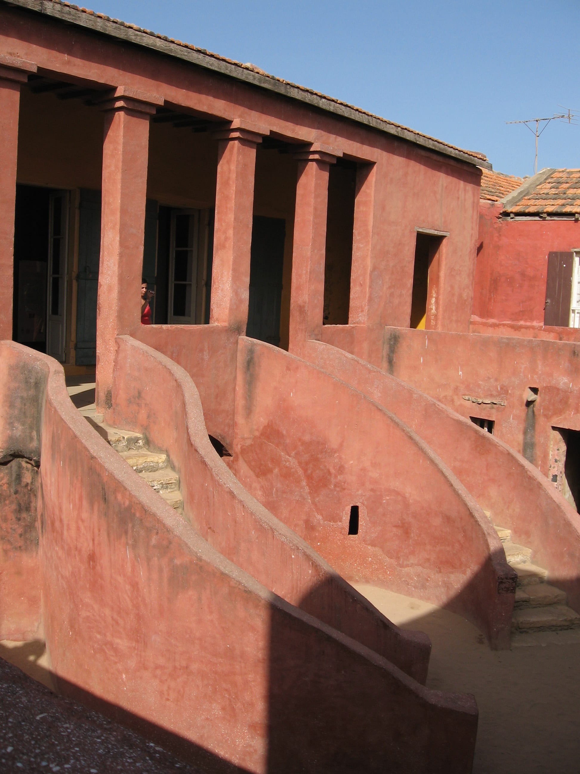 The pink-washed two-storey House of Slaves on Gorée Island with its distinctive curved double staircase