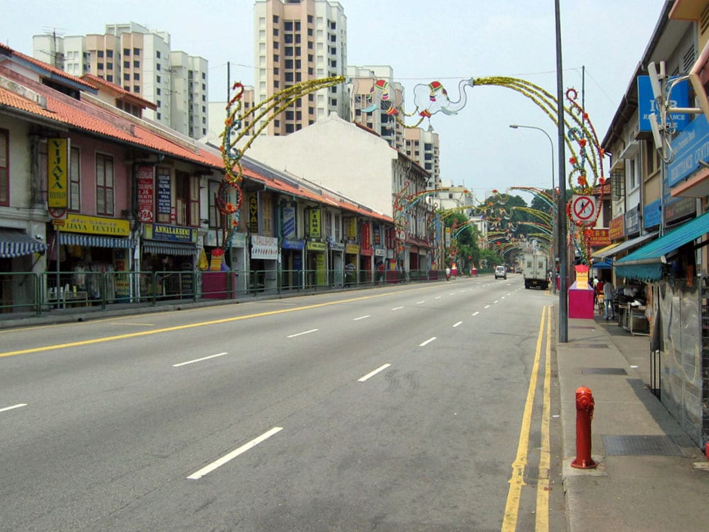 A colourful street lined with Indian shops and decorations