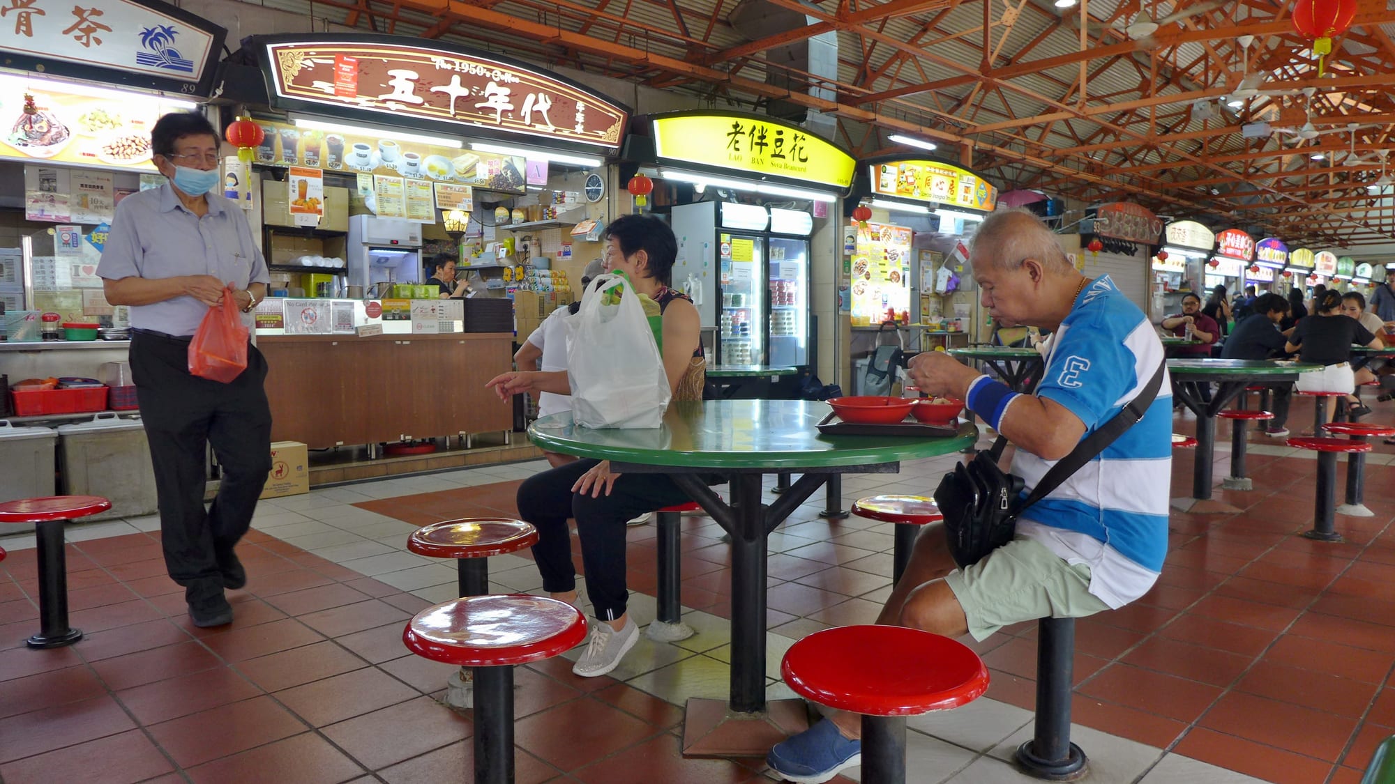 The interior of a busy hawker food centre