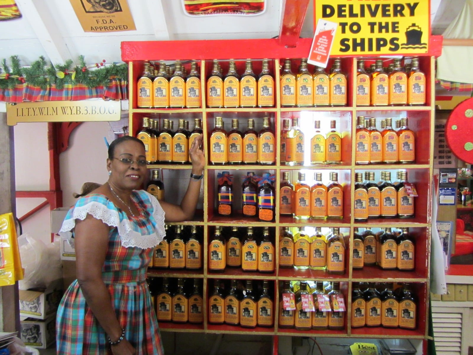 Shelves stocked with bottles of guavaberry liqueur
