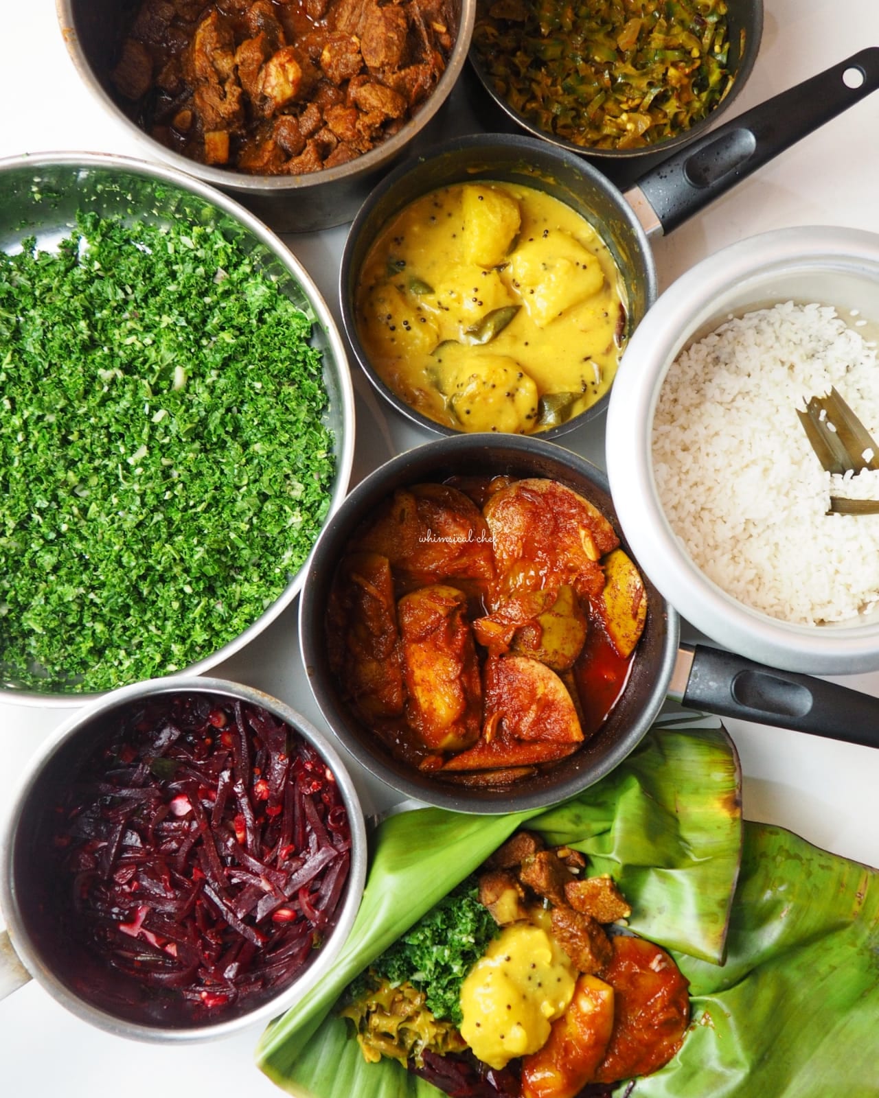 A plate of rice with several curry dishes