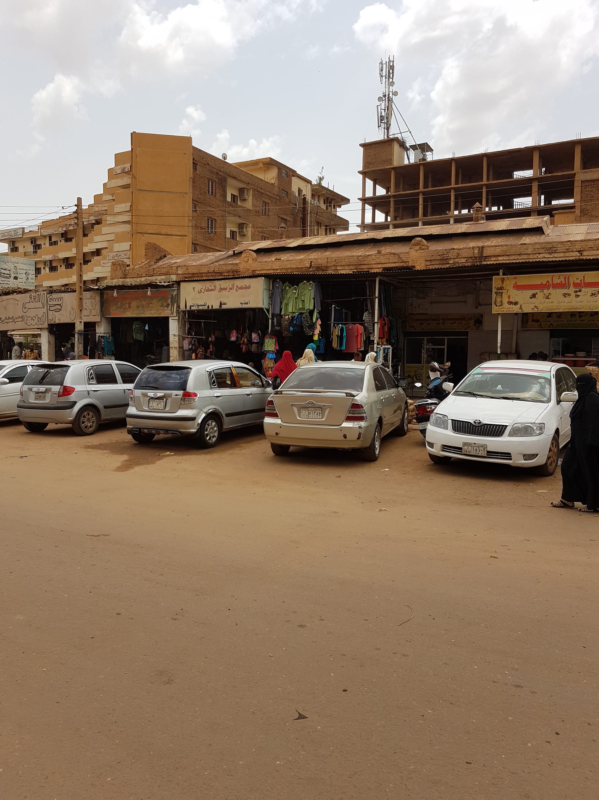 A busy market street with shops and vendors