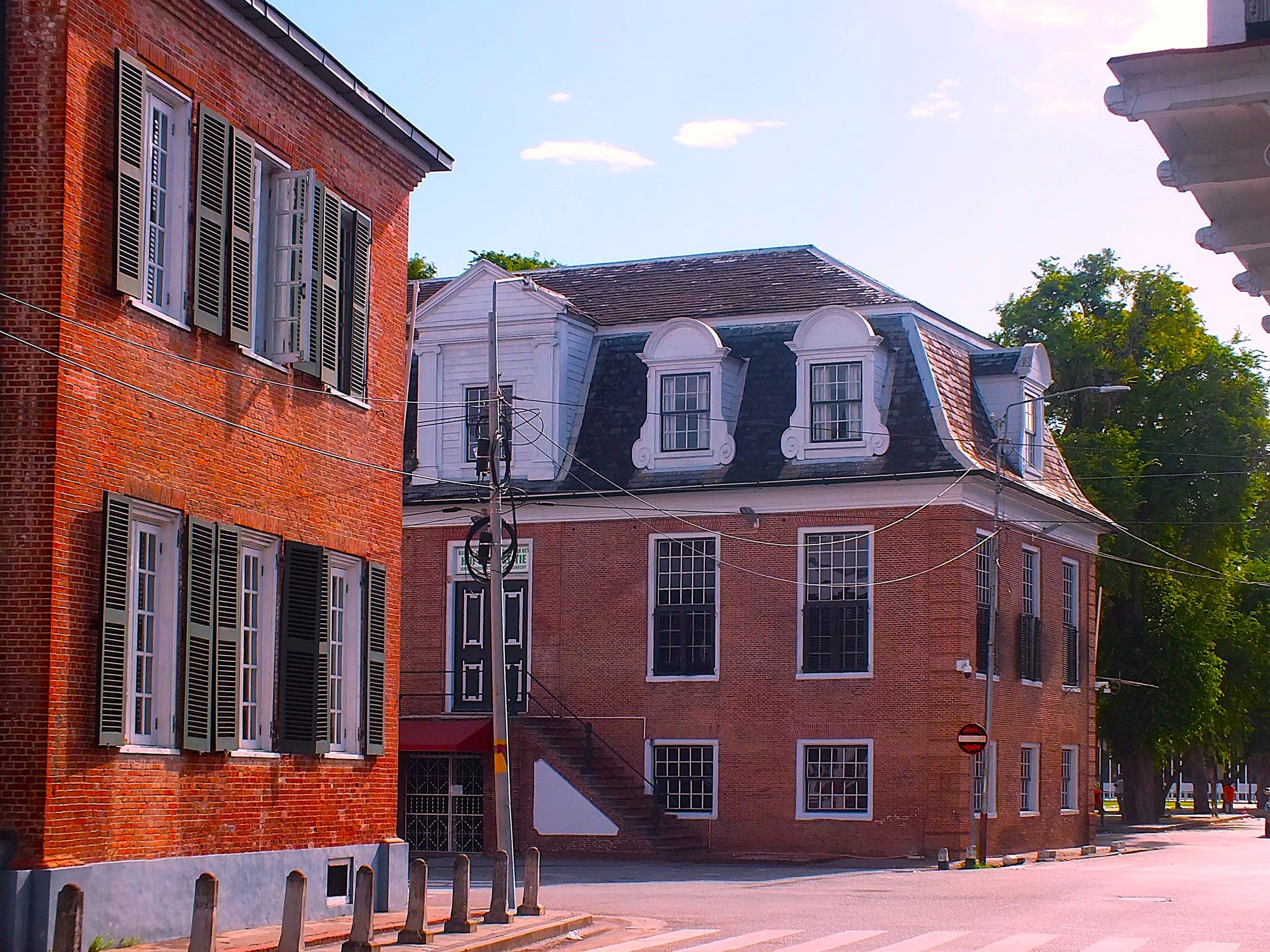 Historic Dutch colonial-era brick and wooden buildings along a street