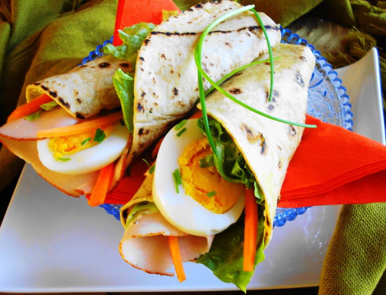 A flatbread wrap filled with curried vegetables