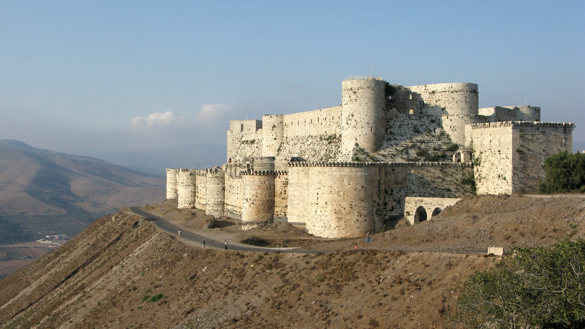 A massive, well-preserved medieval castle on a hilltop