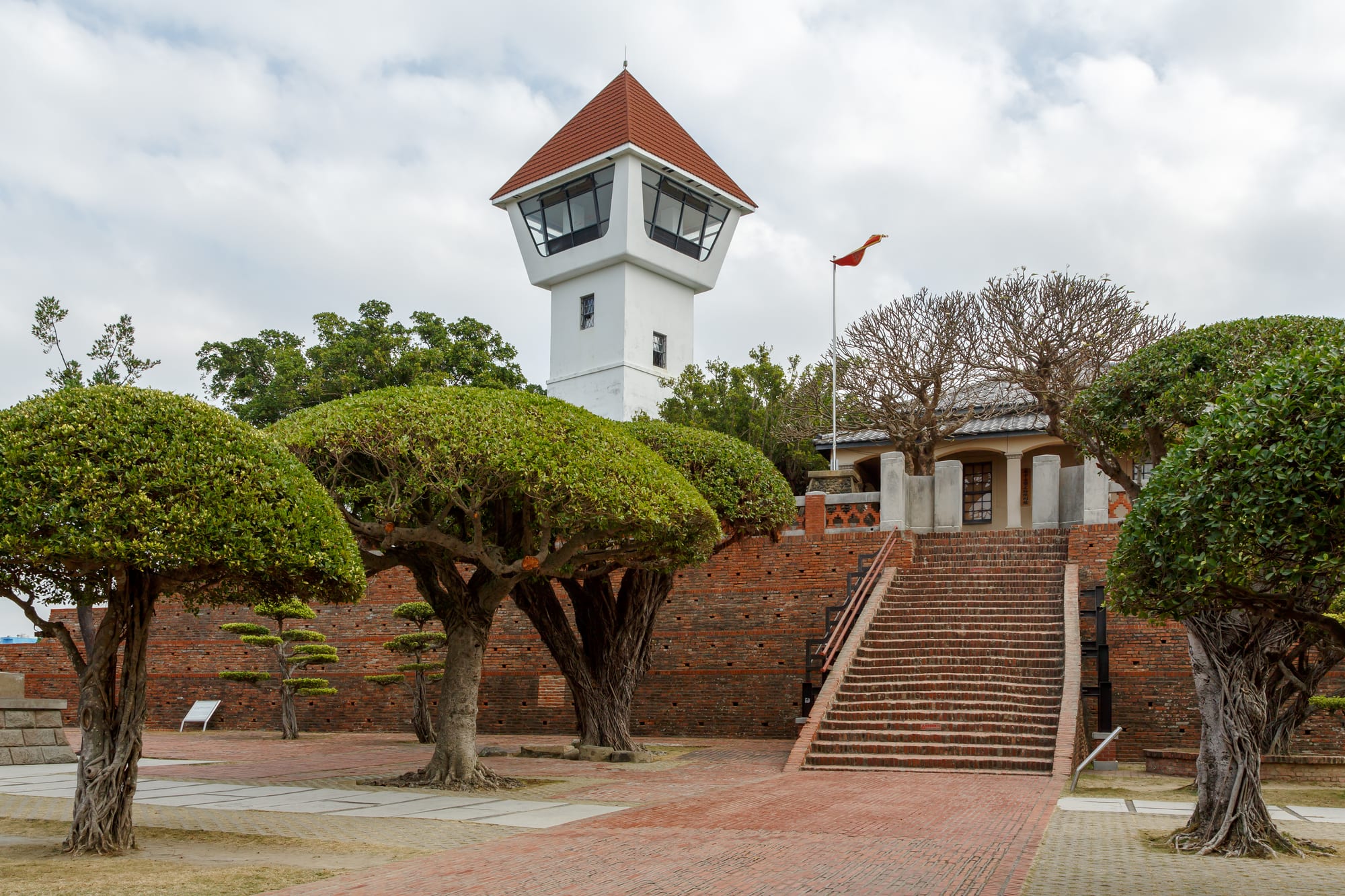 The old brick ramparts and a banyan-shaded wall of Fort Zeelandia in Tainan