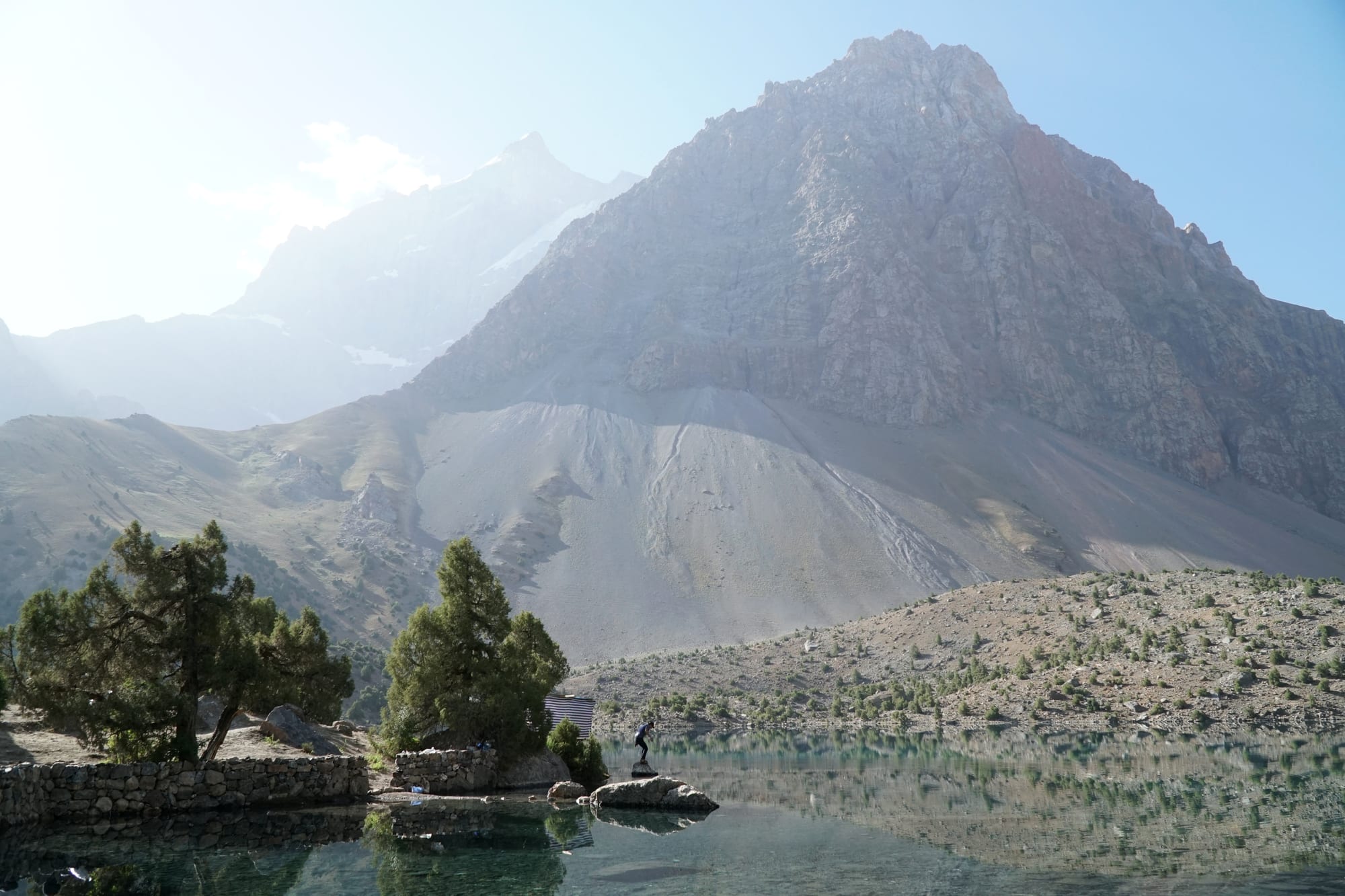 A turquoise alpine lake surrounded by rugged mountains
