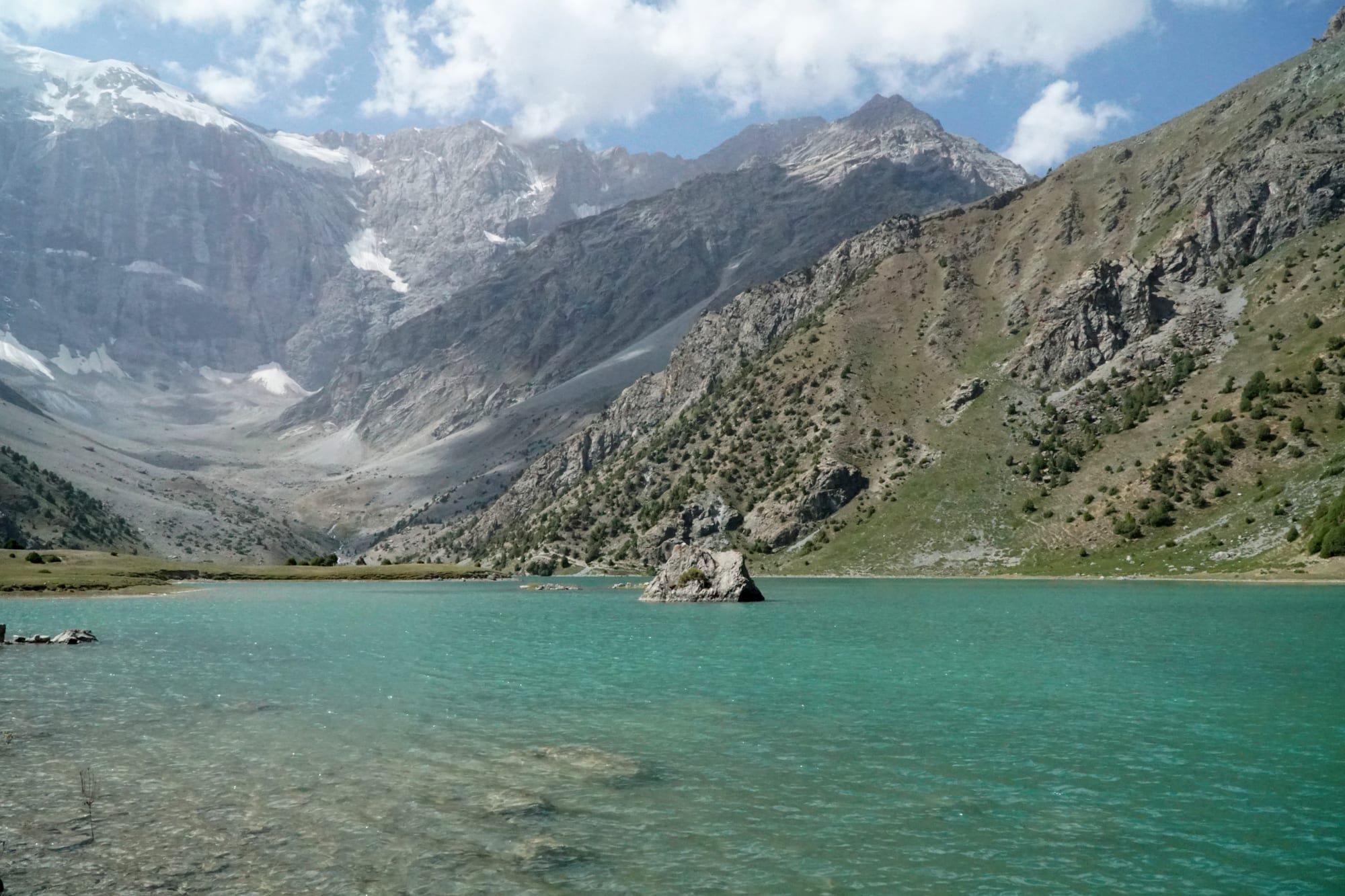 A group of alpine lakes beneath jagged mountain peaks