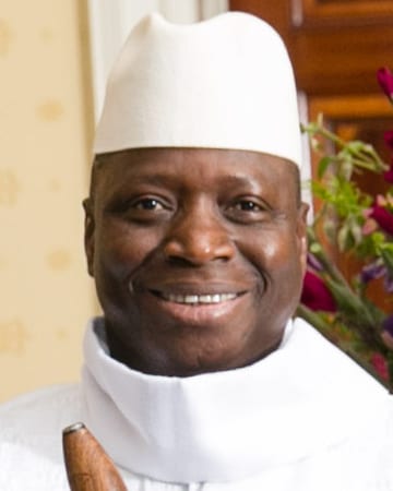 Yahya Jammeh in a white robe and cap, photographed in 2014