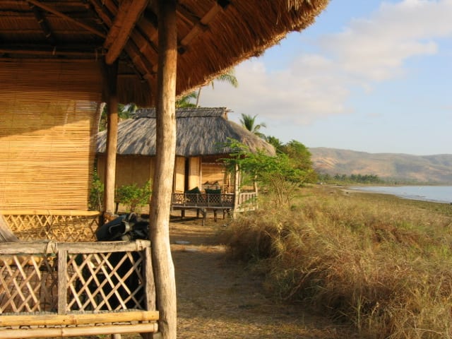 A quiet tropical beach on a small island with clear water