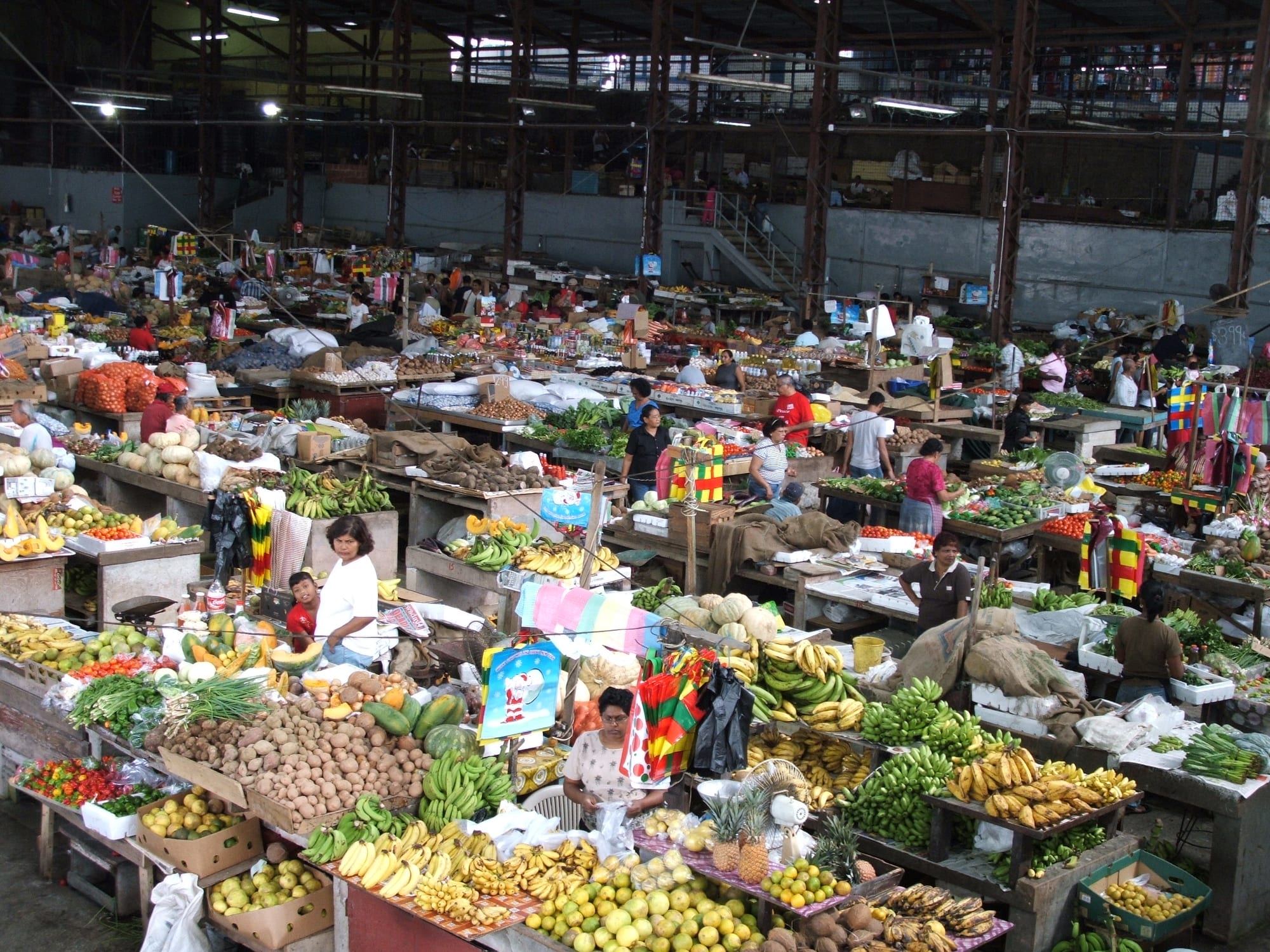 A produce market with stalls and vendors