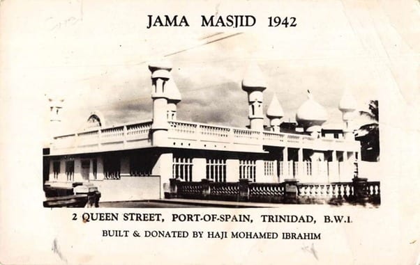 A mosque with domes and a minaret on a street in Port of Spain, photographed in 1942