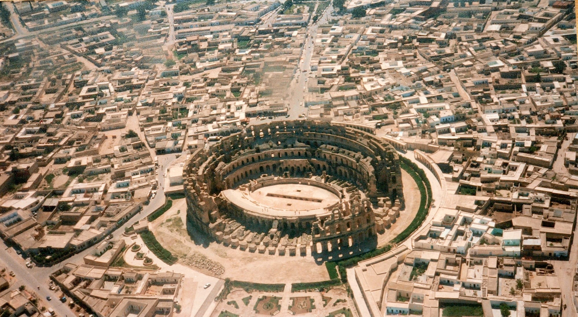 A massive ancient Roman amphitheatre standing largely intact
