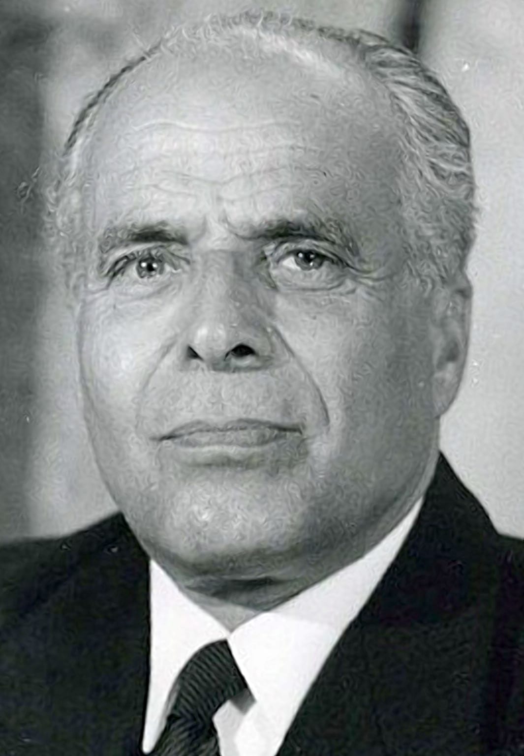 A formal portrait of Habib Bourguiba in a suit