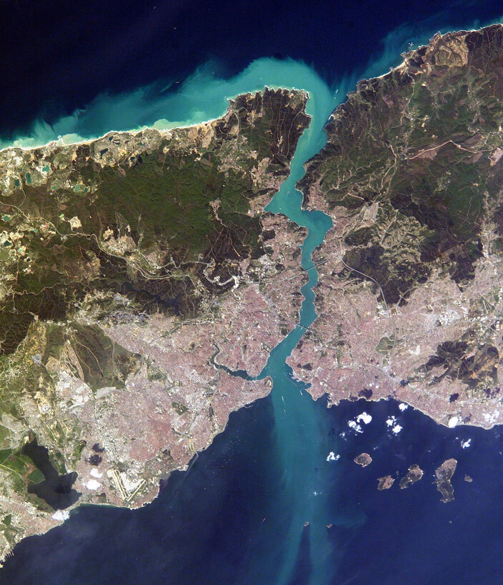 An aerial view of a city straddling a strait between two continents