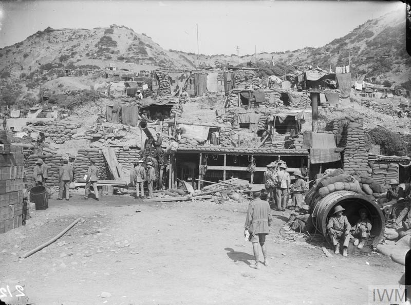 Allied troops and supplies crowded on a narrow beach below cliffs at Gallipoli in 1915