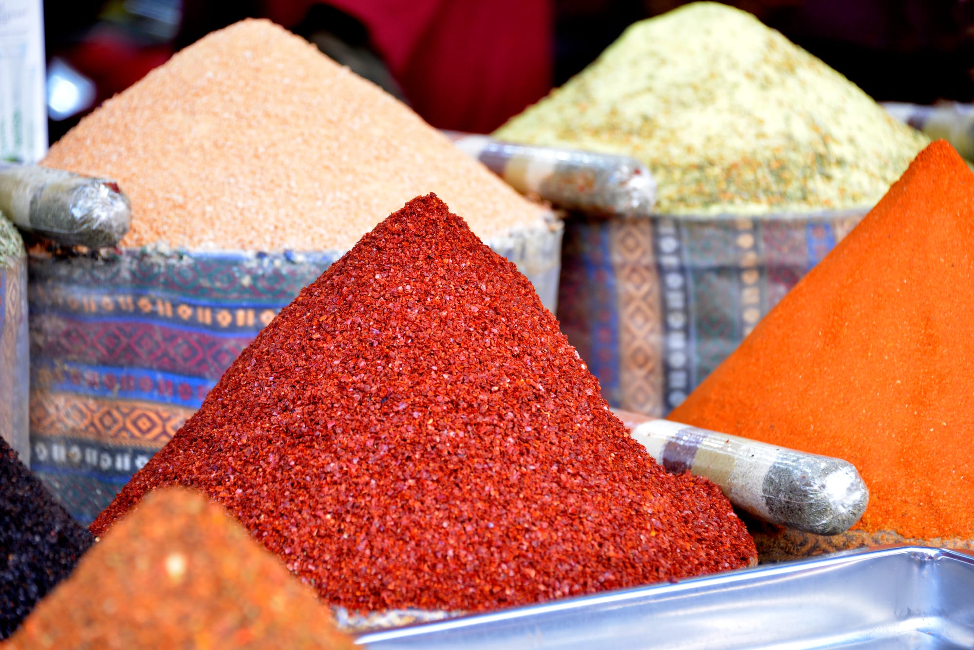 Colourful spices displayed for sale at a market