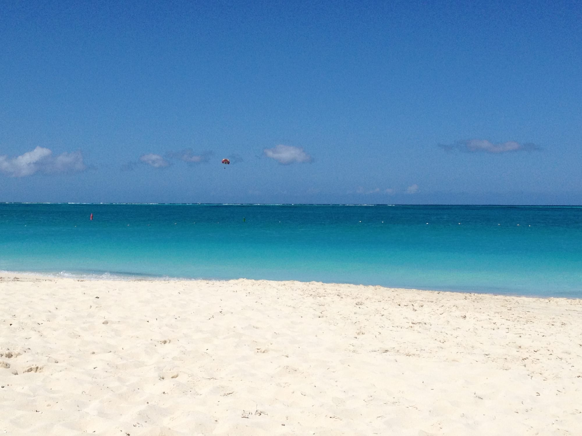 A calm beach cove with clear shallow water