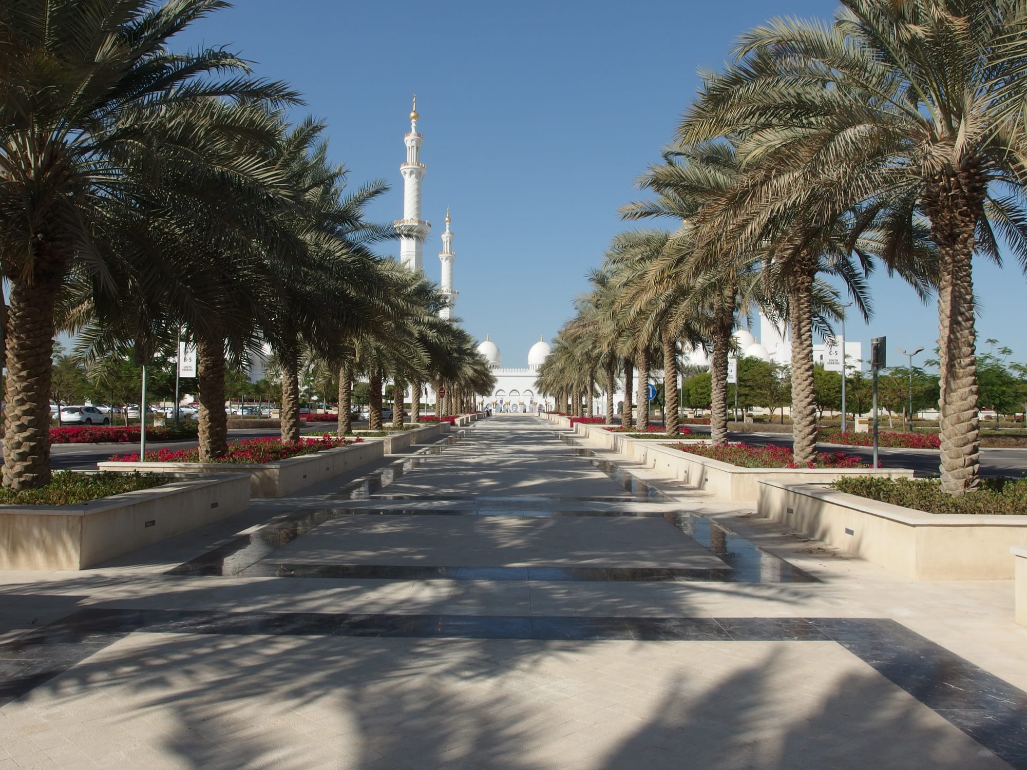 A vast white marble mosque with domes and courtyards