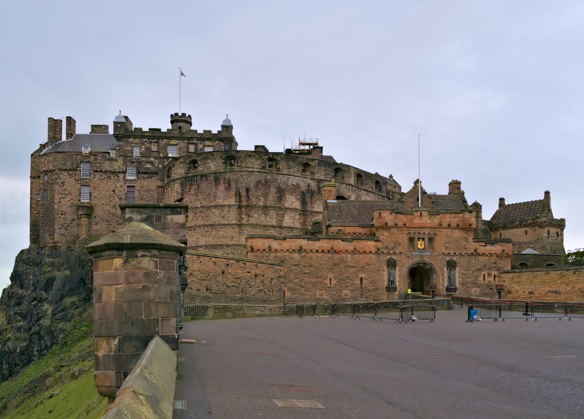 A fortress castle on a volcanic rock outcrop above a city
