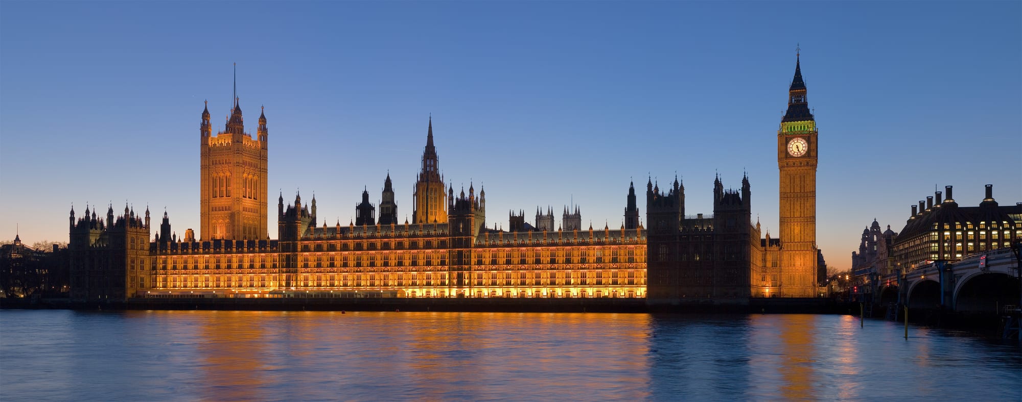 The Gothic-revival Houses of Parliament and the Elizabeth Tower along the Thames in London