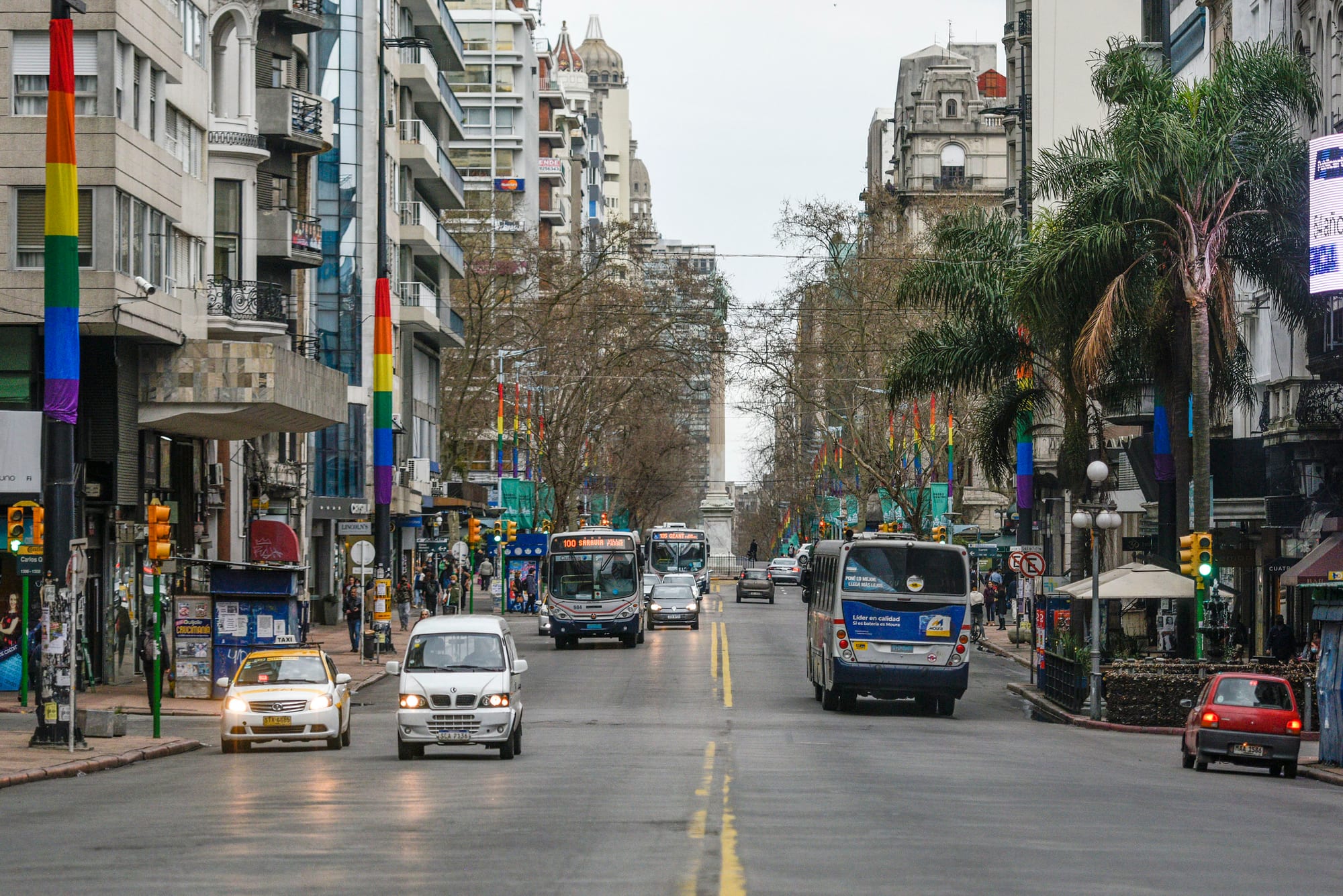 A wide city boulevard with historic buildings