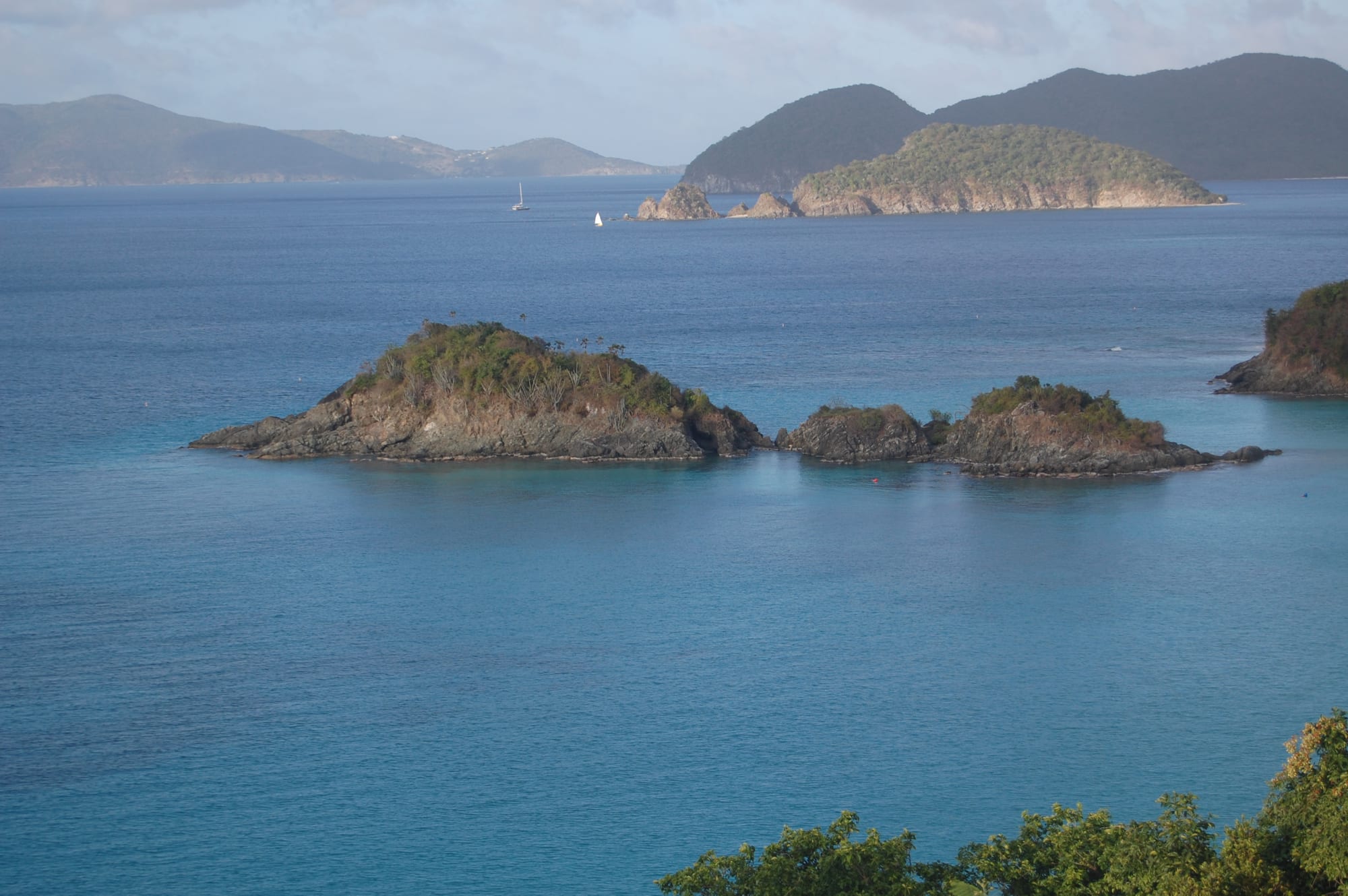 A beach with an underwater snorkelling trail visible in clear water