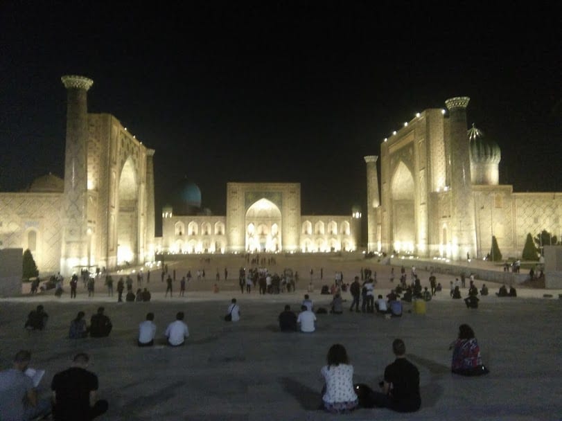 A grand Islamic square illuminated at night