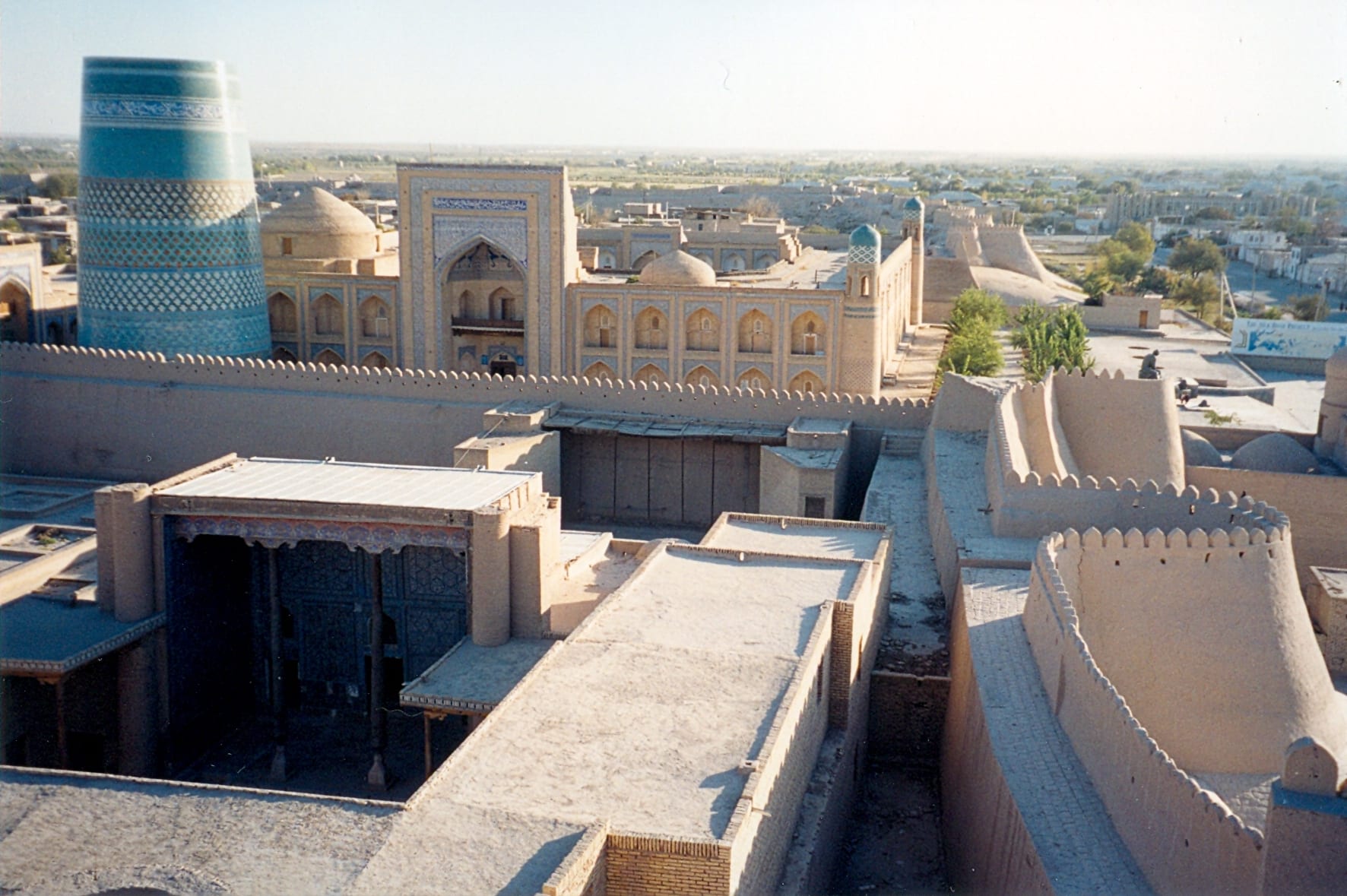 A walled historic city with mud-brick buildings and minarets