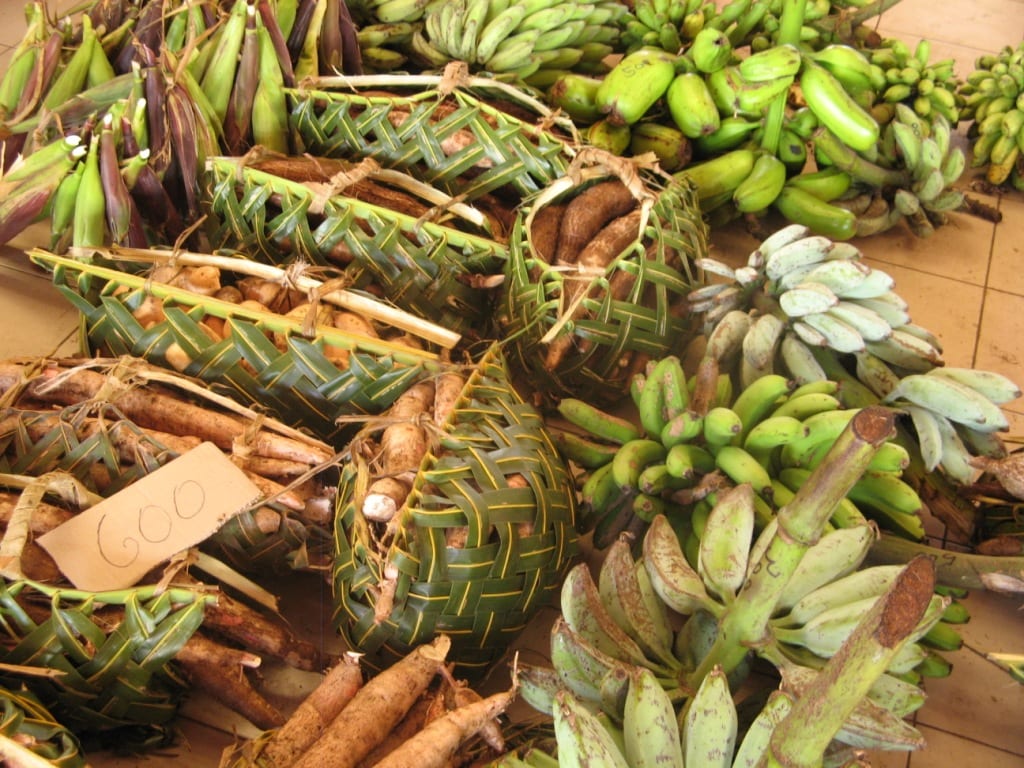 Root vegetables and produce displayed at a market