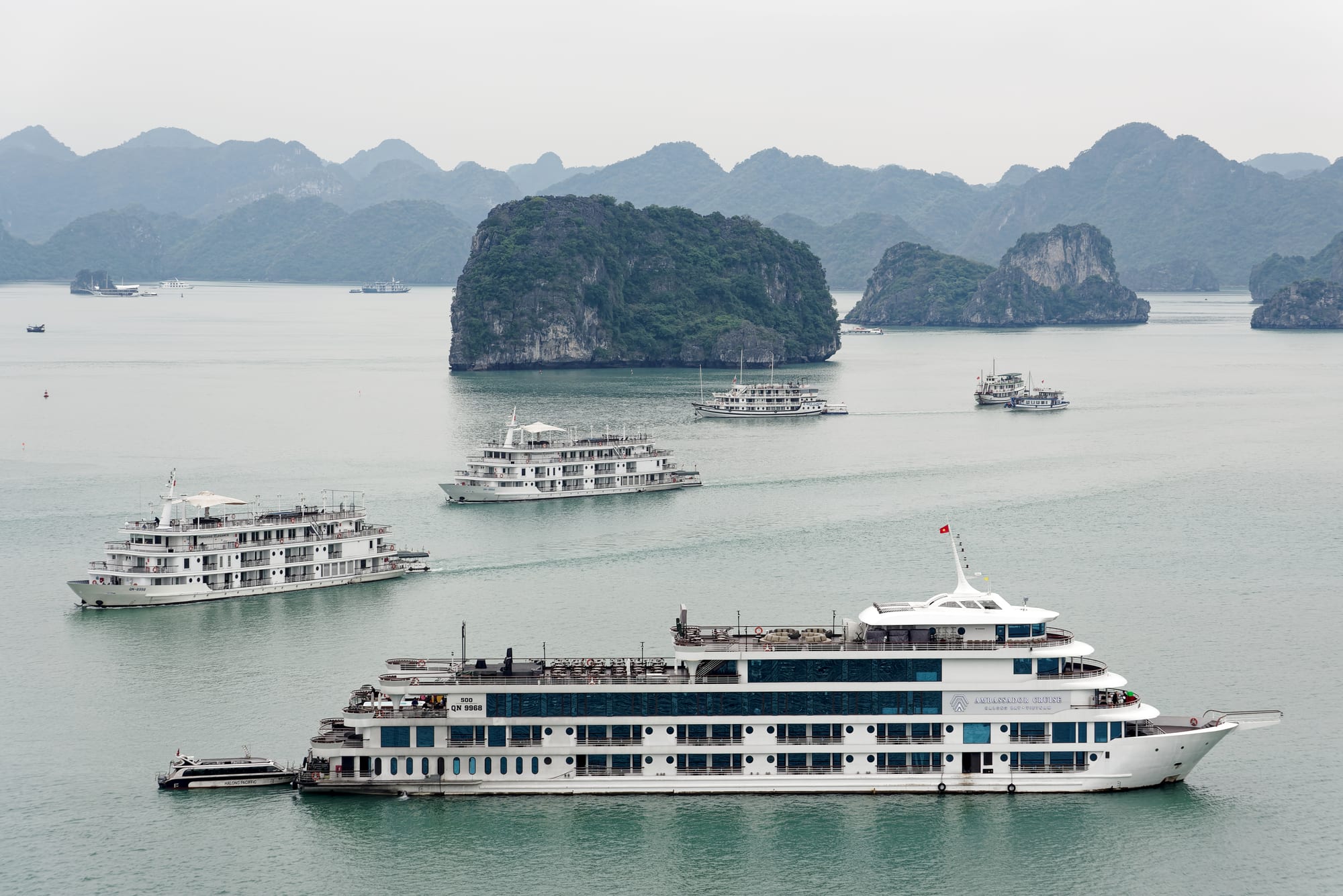 A view over calm water dotted with limestone karst islands