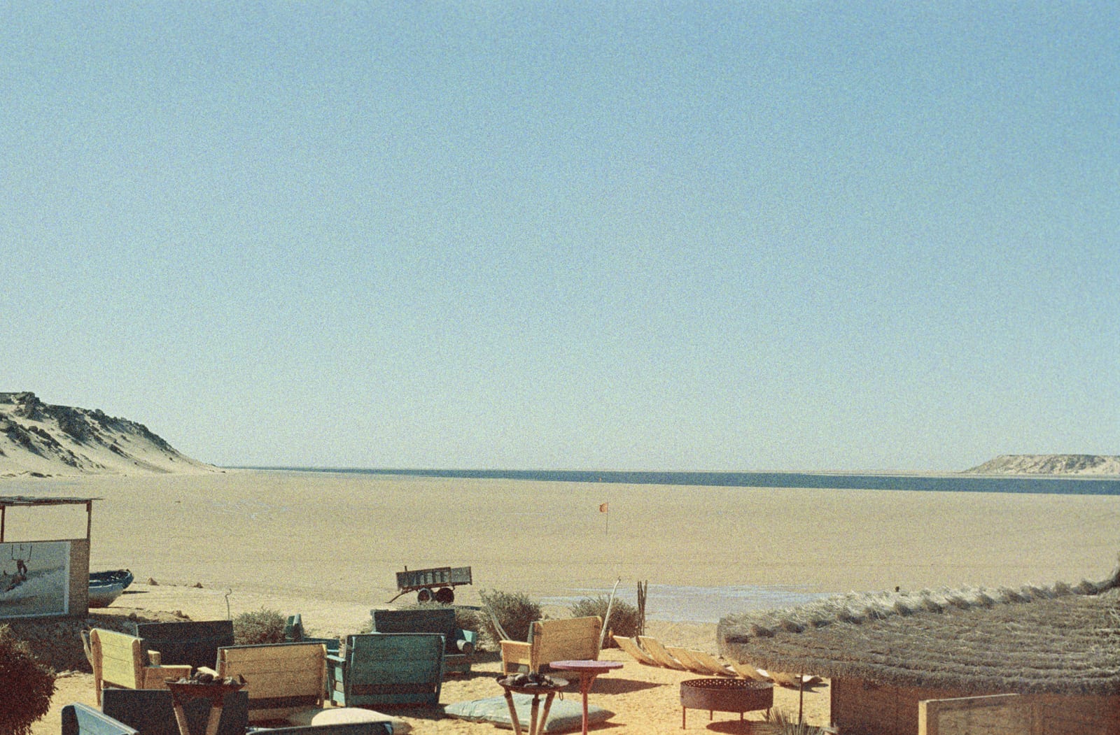 A coastal town beside a calm lagoon in a desert setting