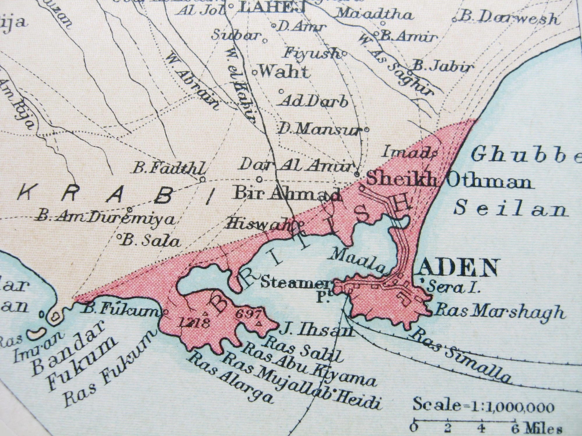 A 1922 view of the harbour and volcanic hills of Aden with ships at anchor and colonial buildings