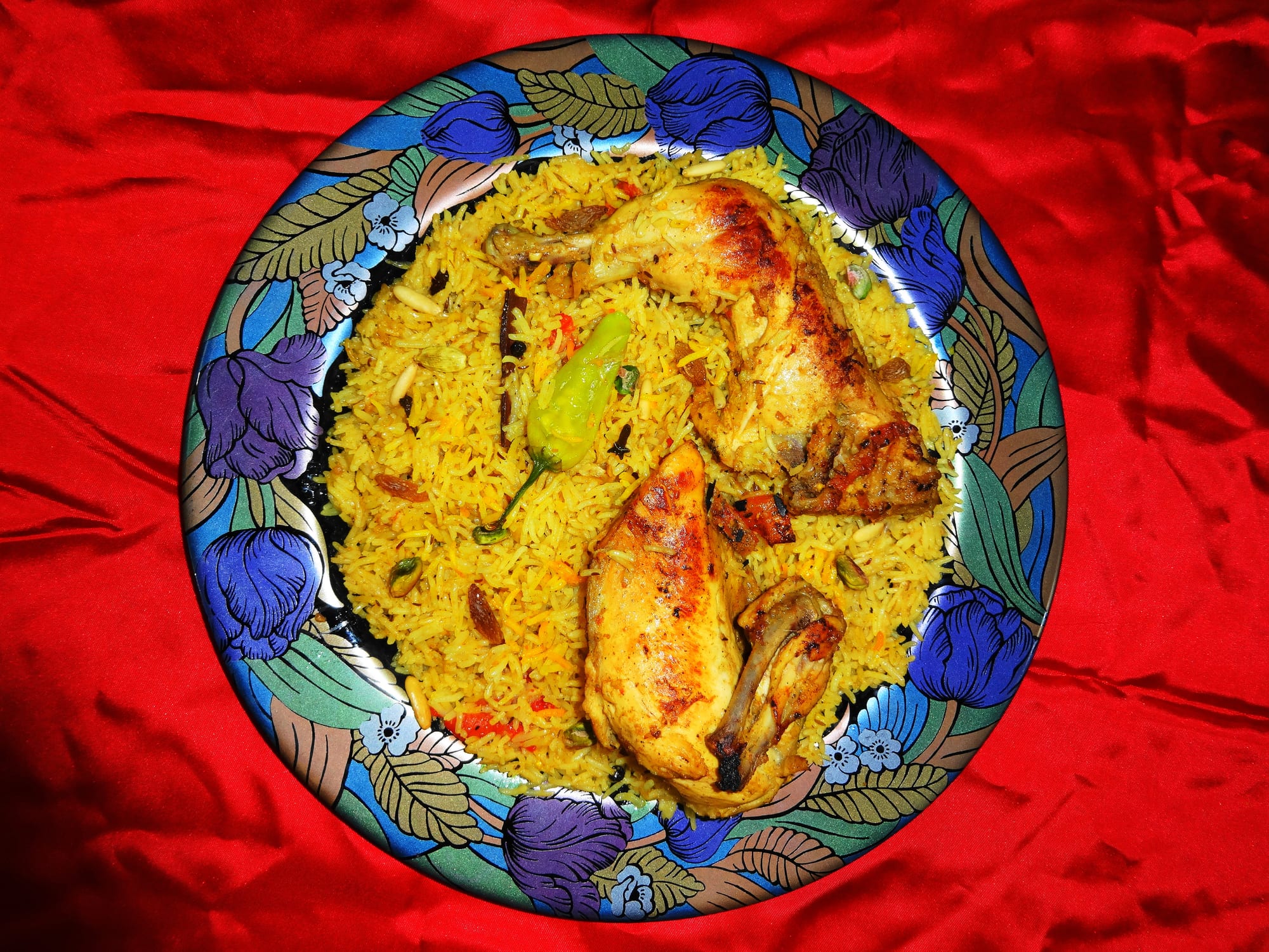 A platter of rice with roasted chicken