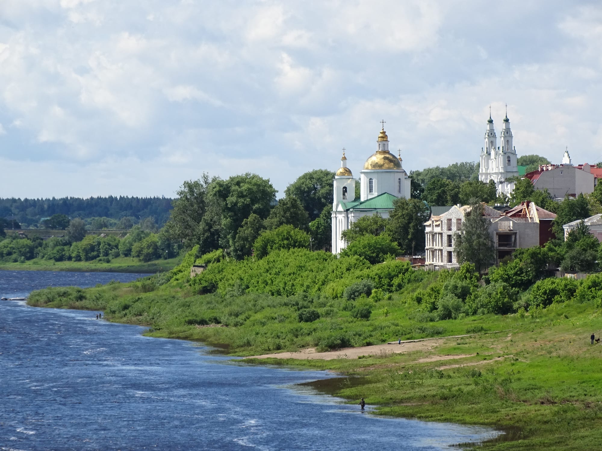 The Western Dvina curving past green banks, with a gold-domed cathedral and the white twin towers of St Sophia above